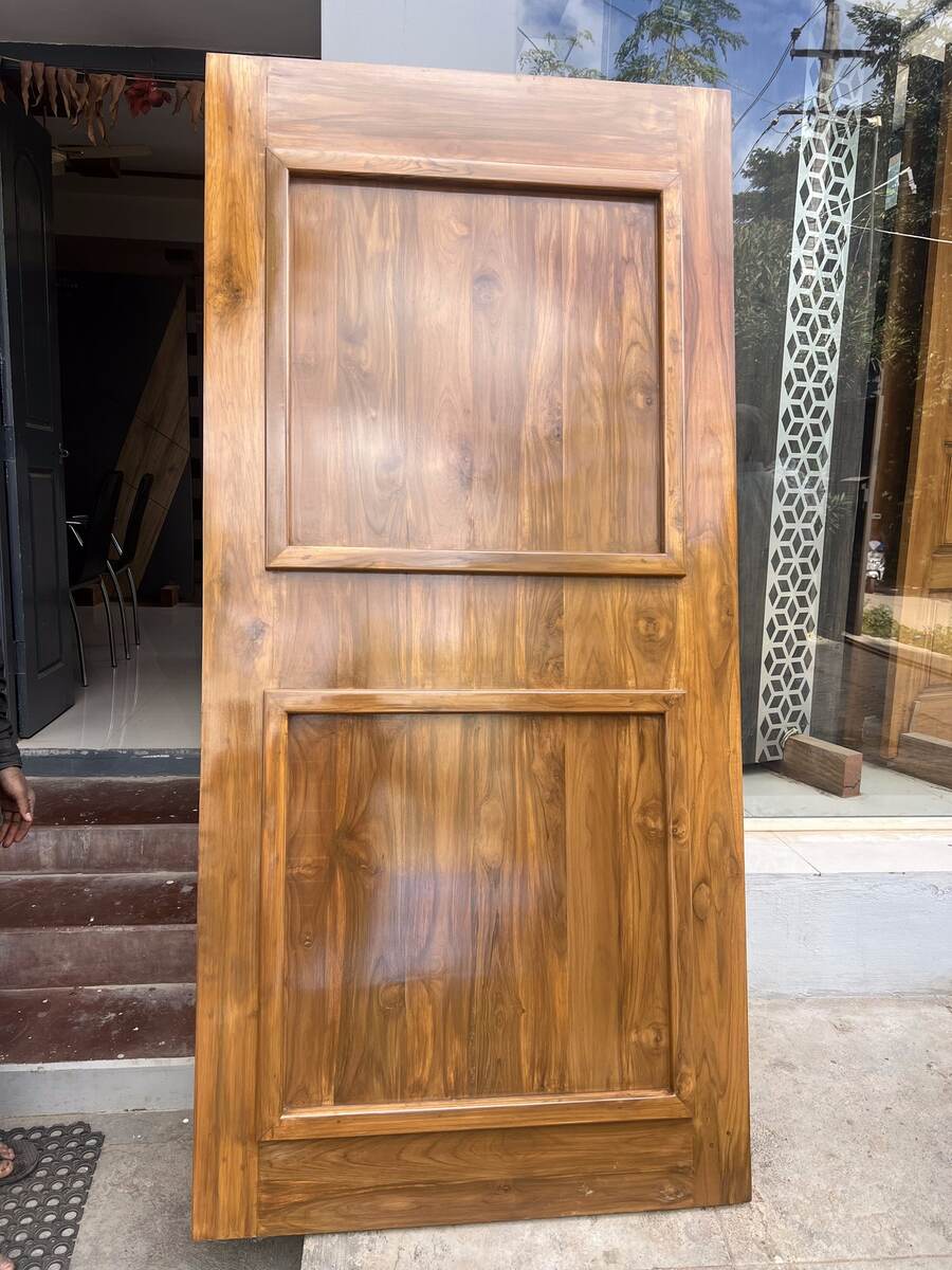 Finished teak door ready for installation at Sri Shiva Saw Mills